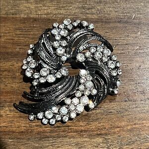 Vintage dark grey swirl and rhinestone brooch